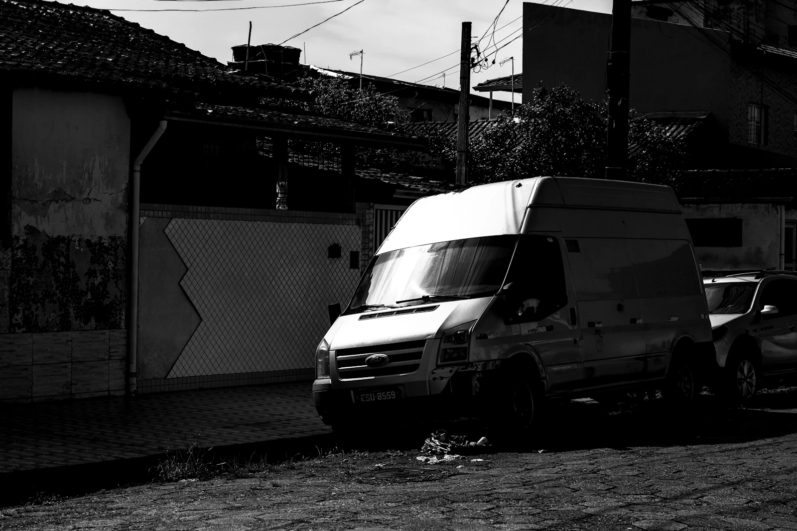 White delivery van parked on a city street