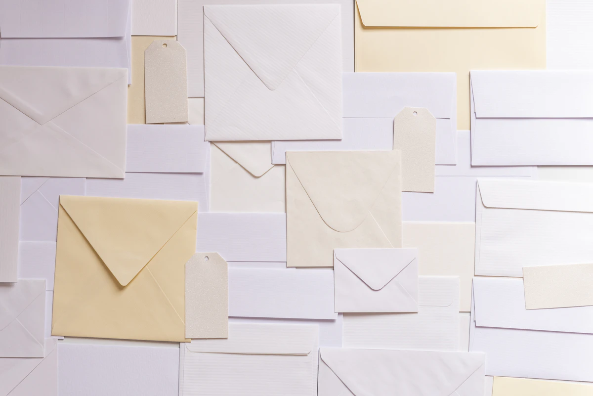 Stack of paper envelopes representing postal and document delivery